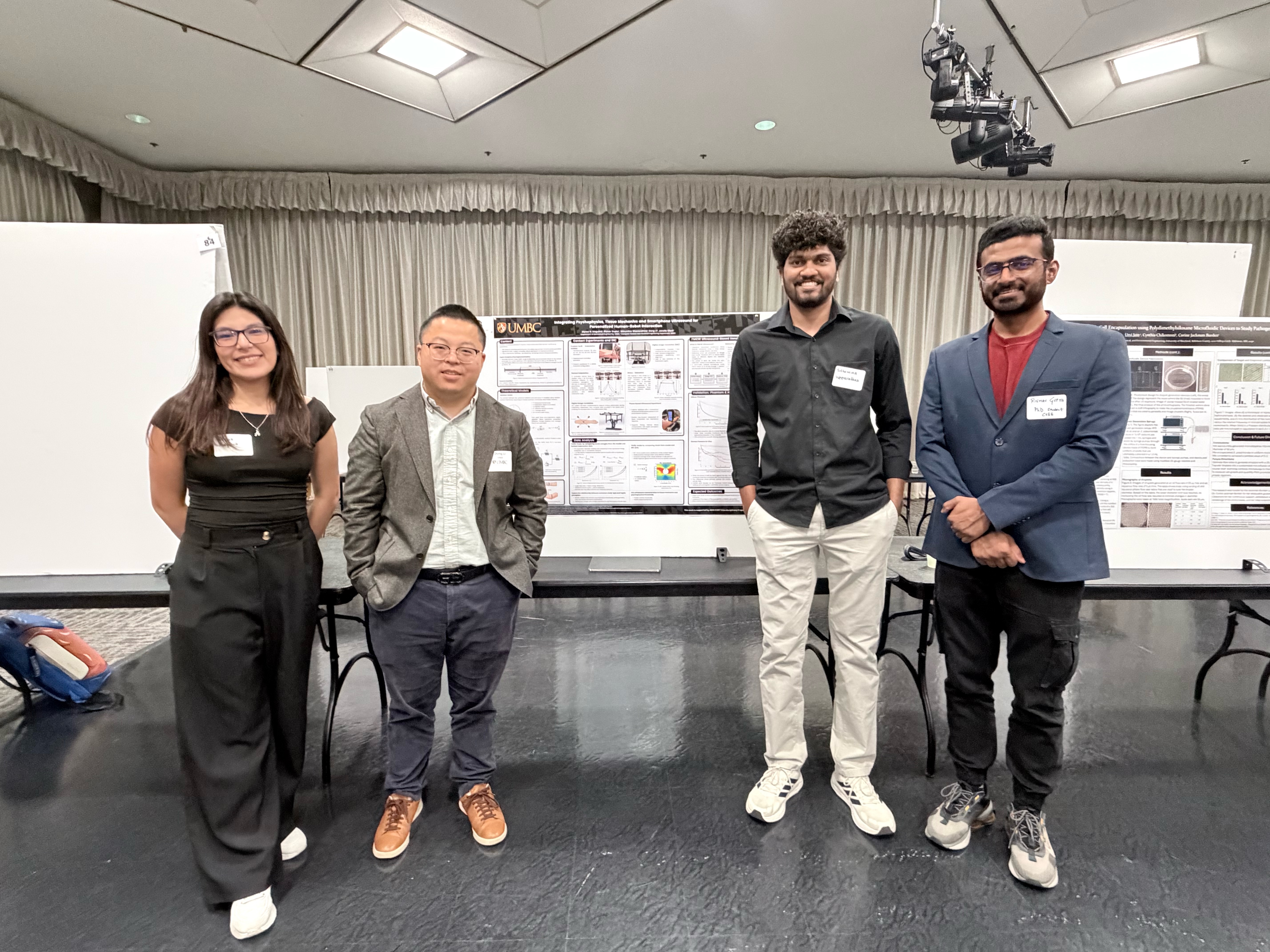 Alyssa N. Maguina, Sithumina Weeraratna, and Rishav Gupta presenting a research poster at COEIT Research Day 2026